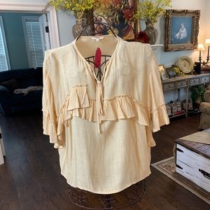 easel butter colored blouse.